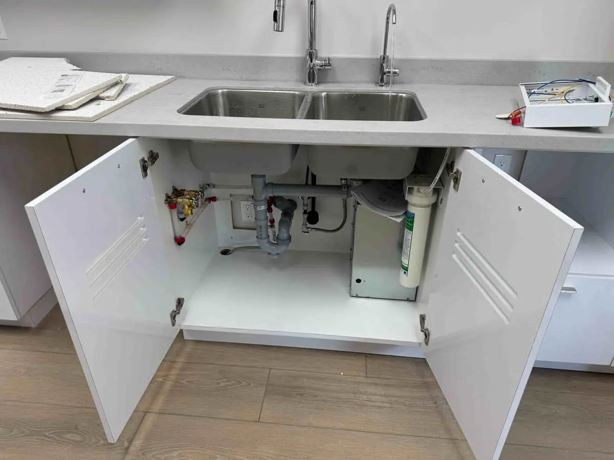 Finished under-sink installation with new shut-off valves and a filtration unit — Quick Plumbing & Drain, serving Creemore, ON