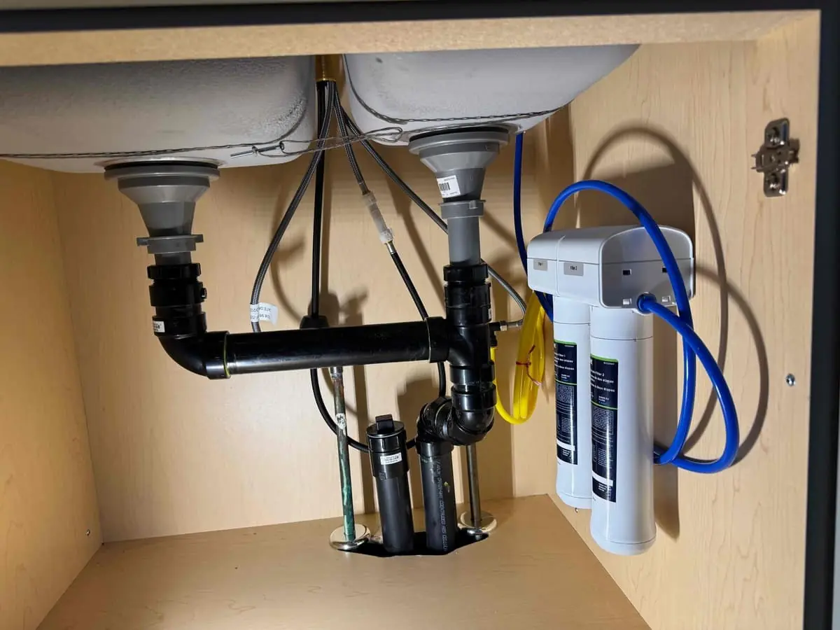 Under-sink drain and supply rough-in with a dual filtration system — Quick Plumbing & Drain, serving Creemore, ON